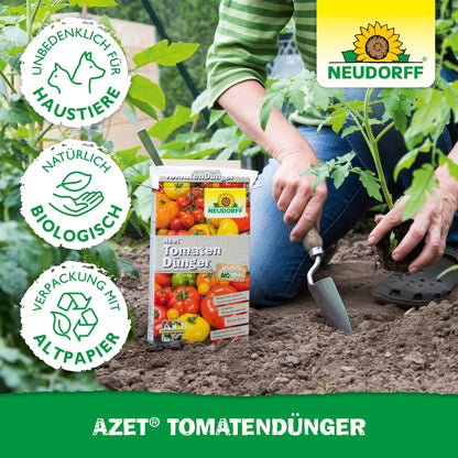 A person uses a garden trowel near tomato plants and has a box of Neudorff Shop Azet Tomato Fertilizer. Eco-friendly and pet-friendly icons highlight this organic fertilizer for "a rich harvest."