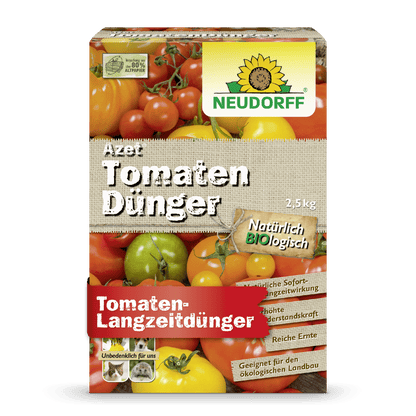 A 2.5 kg package of Neudorff Shop Azet Tomato Fertilizer shows tomatoes and a yellow flower, advertising with text that promises long-term effectiveness for tomato fertilization and a rich harvest.