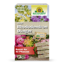 A 1 kg rectangular box of Azet Rhododendron Fertilizer from Neudorff Shop is adorned with blooming flowers, German product information, and a green-yellow Neudorff logo, making it ideal for rhododendrons and azaleas.