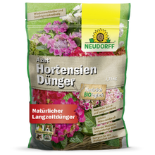 A 1.75-kg bag of Neudorff Shop Azet HortensienDünger, a natural fertilizer for garden hydrangeas, with packaging featuring pink and white blooms and German text.