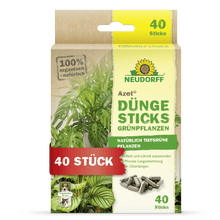 The Azet fertilizer sticks for green plants from Neudorff Shop are delivered in a box with a plant image, product information, and a "40 pieces" label. The packaging highlights the 100% organic, natural ingredients and the nutrient depot technology.