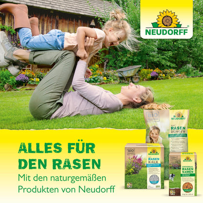 An adult lies on the lawn and playfully lifts a laughing child. In the corner stands Neudorff Terra Preta Soil Improver from Neudorff Shop. Text: "Everything for the lawn and better soil - naturally with Neudorff.