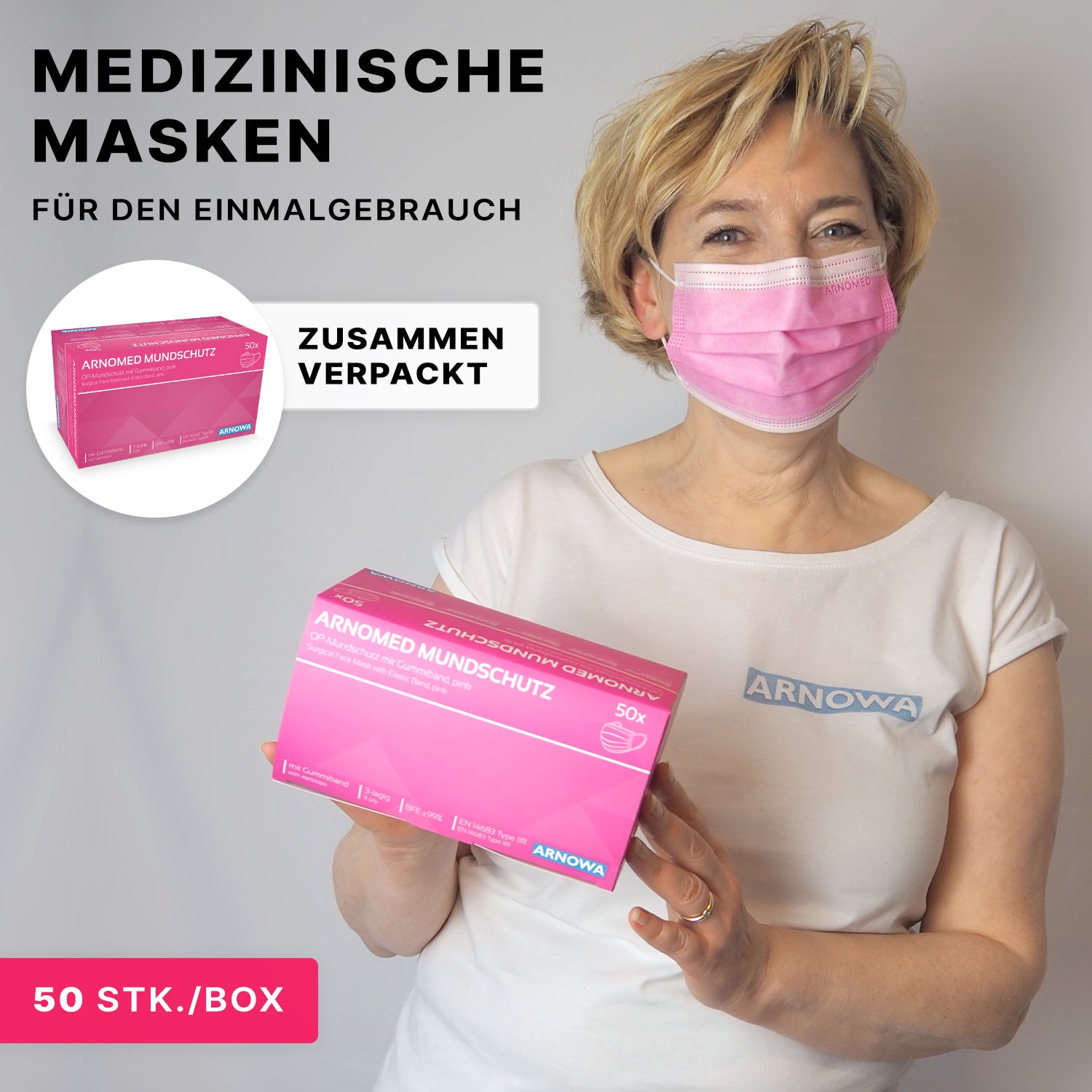 Eine Frau mit einer rosafarbenen medizinischen Maske hält eine rosafarbene Schachtel mit der Aufschrift "ARNOMED MUNDSCHUTZ TYP IIR" der ARNOWA GmbH. Diese Einweg-OP-Mundschutzmasken mit Ohrschlaufen (Typ IIR) sind zu 50 Stück pro Karton verpackt.