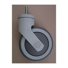 A single Protect Trolley replacement wheel from Diversey Deutschland GmbH & Co. OHG, gray with threaded pin, stands vertically on a plain, light brown background. The package contains 1 piece.