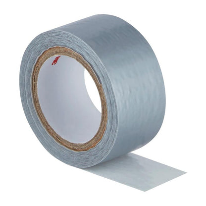 A roll of Scotch® Extremium™ Universal Adhesive Tape from 3M Deutschland GmbH (3 m x 19 mm) is unrolled with a short piece and lies flat, showing the adhesive side and the slightly textured silver surface.