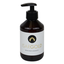 Eine dunkelbraune 250 ml Kunststoff-Pumpflasche der Dr. Schnell ISARGOLD Handseife, Münchner Qualität, von DR.SCHNELL GmbH & Co. KGaA, mit weißem Etikett und schwarz-goldenem Logo, ideal für persönliche Hygiene und empfindliche Haut.