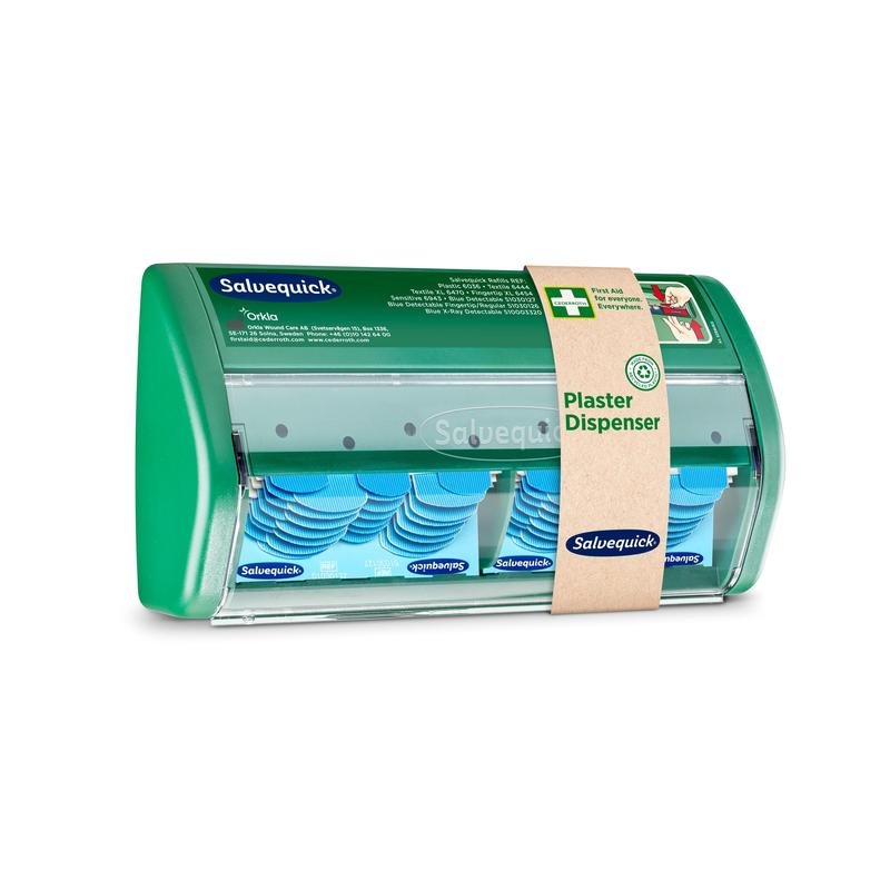 A Salvequick plaster dispenser from Orkla Wound Care AB has a transparent front and dispenses blue, detectable plasters; a brown paper band identifies it as a plaster dispenser".