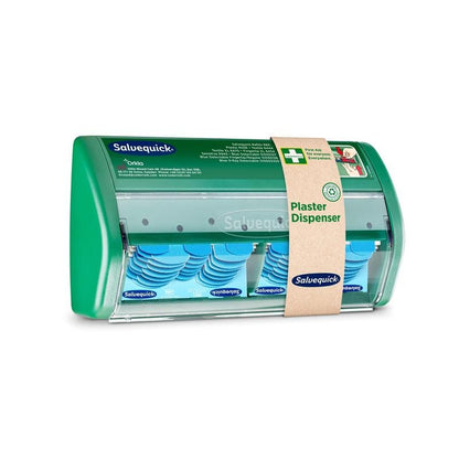 A Salvequick plaster dispenser from Orkla Wound Care AB has a transparent front and dispenses blue, detectable plasters; a brown paper band identifies it as a plaster dispenser".