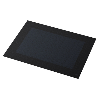 The Duni Dunicel® placemat 30 x 40 cm Linnea Black by Duni GmbH is a rectangular, dark-colored placemat with a subtle pattern. It features a darker central rectangle surrounded by a lighter edge with a woven texture, making it perfect for any dining room. Each pack contains 100 pieces.