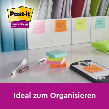 Post-it® Super Sticky Notes (76 mm x 76 mm, 90 sheets/block, 100% PEFC) from 3M Deutschland GmbH are placed together with pens, a smartphone, and folders on a desk; the inscription "Ideal for organizing" and the Post-it logo are visible in the image.