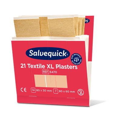 A pink-white box from Orkla Wound Care AB labeled "Xl textile plaster, 21 pieces/mine | Package (6 pieces)" contains large fabric plasters in two sizes: 80x30 mm and 80x60 mm. Several beige plasters can be seen on top of the open box.