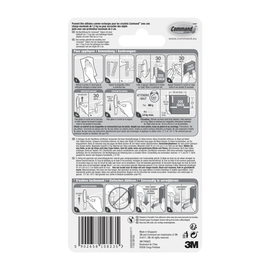 Die Rückseite eines Command™ Strips 17021B, wasserfest, Größe M, 10/Packung von 3M Deutschland GmbH zeigt eine bebilderte Gebrauchs- und Entfernungsanleitung, Produktinformationen, Warnhinweise, mehrsprachigen Text, einen Barcode und das 3M Branding.
