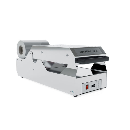 Die Siegelmaschine DF25 - halbautomatisch von Duni GmbH inkl. 1 Kassette DF15/DF25 wird mit angebrachtem Folienspender auf weißem Hintergrund gezeigt. Das Bedienfeld mit Tasten und Drehregler ist vorne rechts sichtbar.