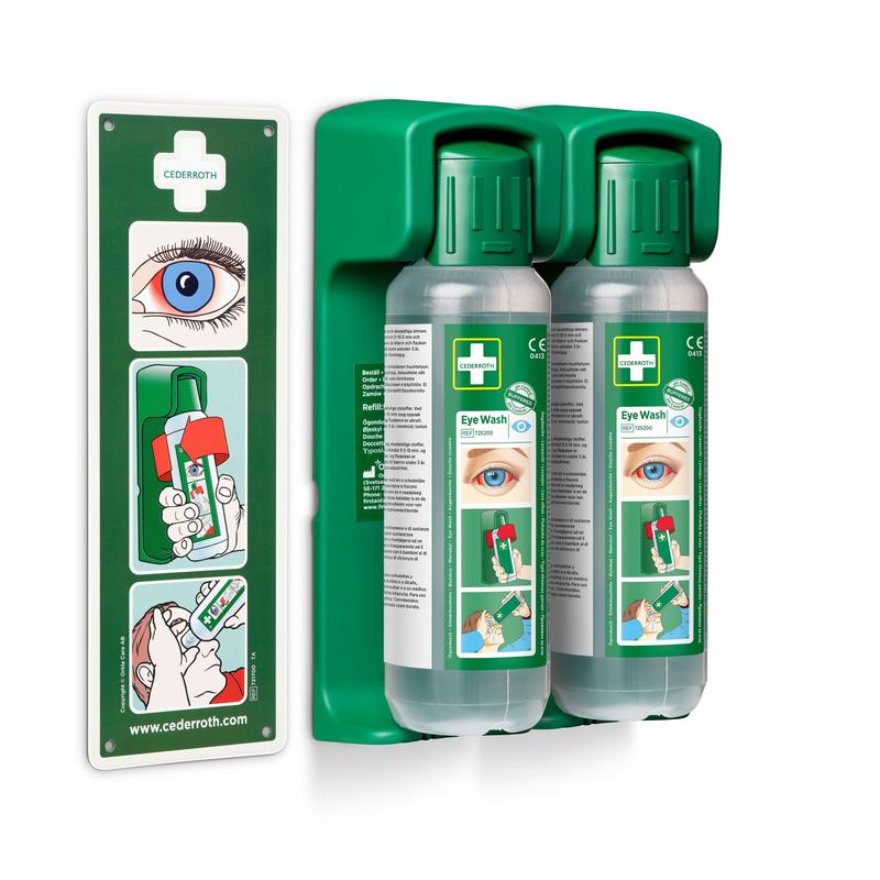 Zwei 500-ml-Augenspülflaschen von Orkla Wound Care AB sind in einer Wandhalterung (für Augenspülung 500 ml, 1 Stück) montiert; ein leuchtendes Hinweisschild für den Einsatz im Notfall ist enthalten.
