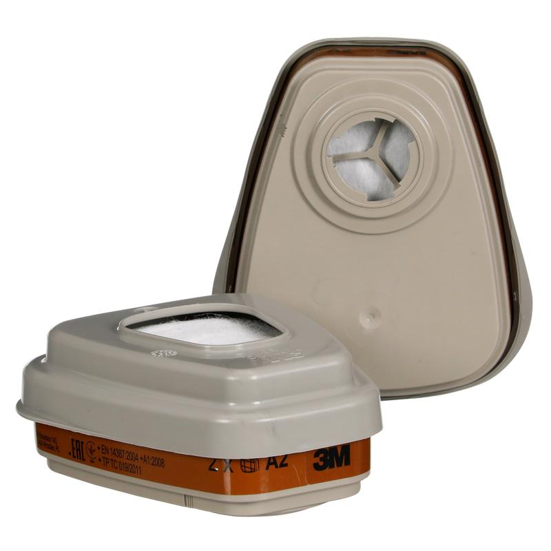 Pictured are two beige 3M™ Filter Set 6002-1SP, A2P2 organic vapors from 3M Deutschland GmbH - one upright with the intake opening, the other flat with the filter surface and product details. The package contains 1 piece.