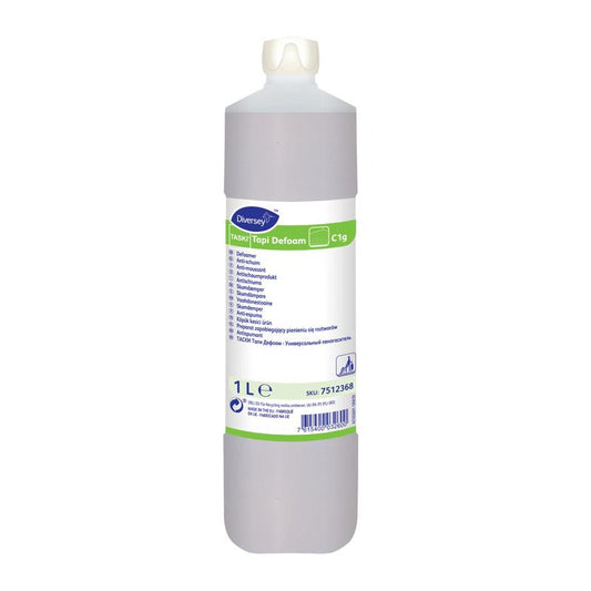 Eine 1-Liter-Flasche TASKI Tapi Defoam, Anti-Schaumprodukt von Diversey Deutschland GmbH & Co. OHG, hat einen weißen Verschluss und ein mehrsprachiges Etikett mit Produktinformationen und Anweisungen.