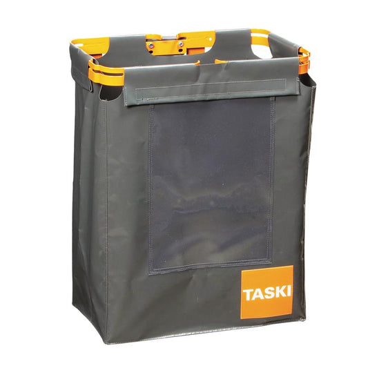 Der TASKI Übersack für Abfallsäcke von Diversey Deutschland GmbH & Co. OHG ist ein rechteckiger, dunkelgrauer Stoffbehälter mit orangefarbenen Griffen, einem orangefarbenen Rahmen, einer durchsichtigen Vordertasche und einem TASKI-Etikett - perfekt für die hygienische Abfallentsorgung.