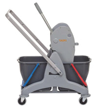 A gray TASKI Duo Mop two-bucket system by Diversey, with two 15L buckets (blue for clean, red for dirty water), four wheels, handle, and press - ideal for hygienic cleaning.