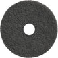 A round, black TASKI Americo Dominator Pad 17" (43 cm) from Diversey Deutschland GmbH & Co. OHG with a rough texture and center hole - an extra aggressive stripping pad, ideal for intensive floor cleaning (Package: 1 piece).
