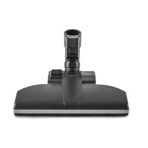 Die TASKI Aero UP Standarddüse von Diversey Deutschland GmbH & Co. OHG ist ein schwarzer Bodenaufsatz mit rechteckiger Basis und zentralem Anschluss, perfekt für gewerbliche Bereiche. Passend für den TASKI Aero UP, Packung (1 Stück), abgebildet Frontansicht auf weißem Hintergrund.