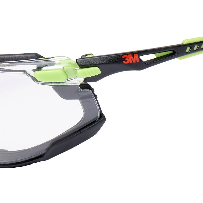 Close-up of the 3M™ Solus™ Safety Glasses 1000 from 3M Deutschland GmbH, with black and lime green frame, transparent lenses with Scotchgard™ anti-fog coating, and removable foam gasket.