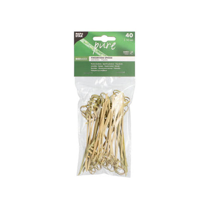 In a transparent plastic bag are 40 PAPSTAR 40 finger food picks "pure" bamboo skewers from PAPSTAR GmbH with loops at the ends and a green label emphasizing environmental friendliness - perfect for serving finger food.