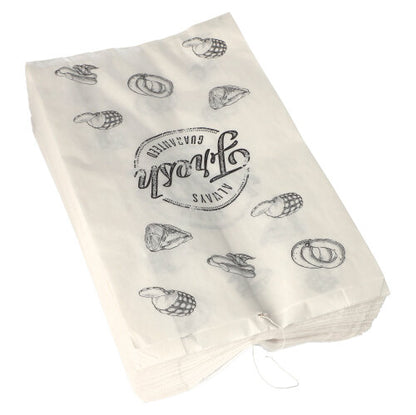 A stack of PAPSTAR 1000 butcher bags made of kraft paper, threaded, from PAPSTAR GmbH, with black illustrations of pretzels, cupcakes, and the circular inscription "Unna's Quality."
