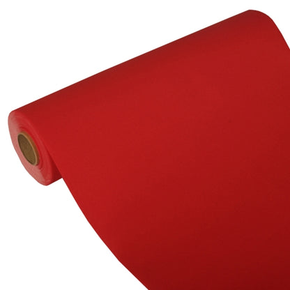 The PAPSTAR table runner, Tissue "ROYAL Collection" (24 m x 40 cm) from PAPSTAR GmbH consists of bright red tissue material, partially unrolled on a brown cardboard roll and presented at an angle against a plain background.
