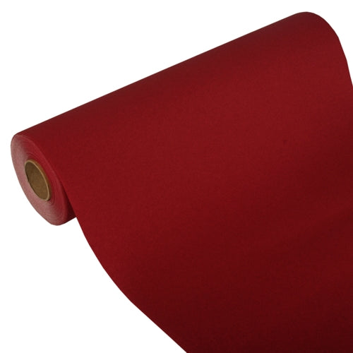 A partially unrolled table runner from PAPSTAR GmbH, Tissue "ROYAL Collection" (24 m x 40 cm), shows its cardboard core on a white background, demonstrating its high-quality tissue material and elegant design.