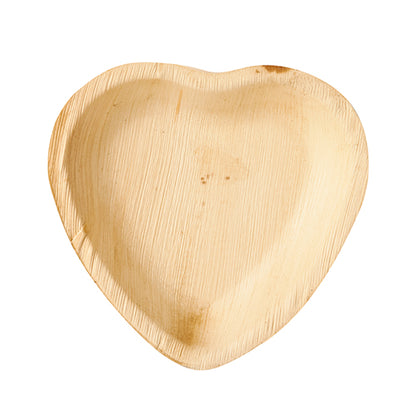 The PAPSTAR plate palm leaf "pure" heart shape (15.5x3 cm) made from sustainable palm leaf is delivered in a pack of 25 - biodegradable disposable tableware, ideal for environmentally conscious celebrations.