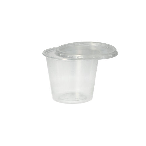 Der Starpak 50 Dressingbecher, PP rund Ø 7,1 cm transparent, ist ein kleiner durchsichtiger Polypropylenbecher mit passendem transparenten Deckel von Starpak, abgebildet vor einem schlichten weißen Hintergrund.
