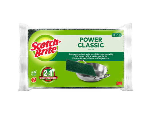 Eine Packung der 3M Deutschland GmbH Scotch-Brite® Classic Scheuerpads, 3 Pads pro Packung. Die grün-weiße Verpackung zeigt einen Metalltopf, der gerade geschrubbt wird, mit Produktangaben in mehreren Sprachen. Packung mit 3 Stück.