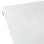 The Starpak tablecloth, fabric-like fleece "soft selection" (40 m x 1.18 m) in white is partially unrolled, showing its smooth, light structure and the visible cardboard core.