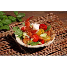 Enjoy shrimp, cherry tomatoes, croutons, arugula, and spring onions in a PAPSTAR GmbH palm leaf bowl "pure" round (13 cm), environmentally friendly - perfect sustainable disposable tableware for eco-conscious events.