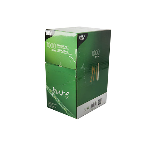 Eine grün-weiße Schachtel mit PAPSTAR 1000 Rührstäbchen Holz „pure“, einzeln gehüllt von der PAPSTAR GmbH, umweltfreundlich, mit Produktinformationen und Markenzeichen auf der Verpackung sichtbar. Enthält 1.000 Teile.