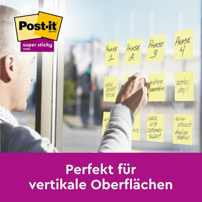 A person sticks yellow Post-it® Super Sticky Notes (47.6 x 47.6 mm, 90 sheets/block, 100% PEFC) with the label "Phase 1-4" on a glass wall. Text below: "Perfect for vertical surfaces." From 3M Deutschland GmbH.