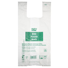 Die 100 Hemdchen-Tragetaschen der PAPSTAR GmbH sind transparente, biologisch abbaubare Bio-Folie-Knotenbeutel auf einer Rolle mit grünem „PAP STAR BIO FOOD BAG“-Text und mehrsprachigen Informationen zur Kompostierbarkeit und zu nachwachsenden Rohstoffen.