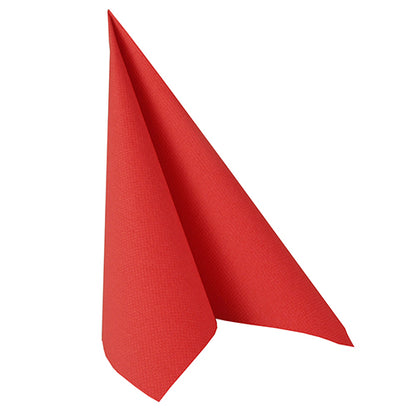 A red PAPSTAR 100 napkins "ROYAL Collection" 1/4-fold 40 cm x 40 cm napkin of PAPSTAR GmbH is upright folded into a triangular, cone-shaped structure in front of a plain white background.