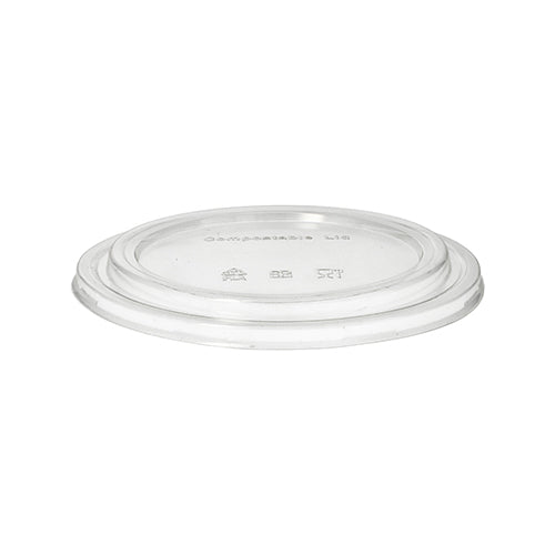 A PAPSTAR 50 lid for salad bowls, round clear 2 cm height PLA of PAPSTAR GmbH is depicted lying flat on a white background. This compostable, eco-friendly lid fits disposable cups or containers.