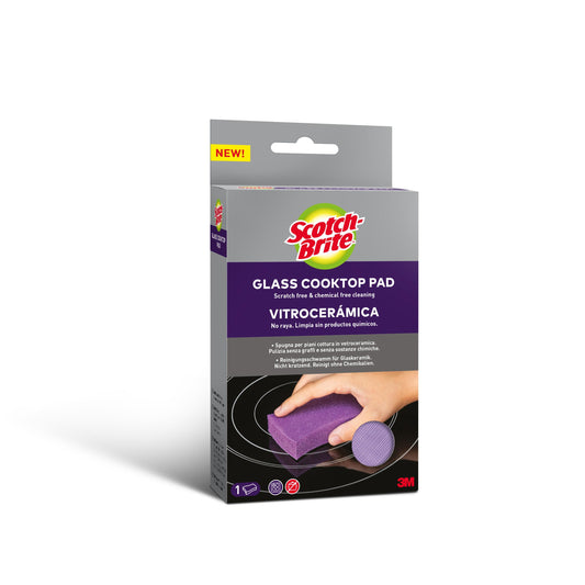Abgebildet ist eine Schachtel Scotch-Brite™ Glaskeramik-Reinigungsschwamm (1 Stück) der 3M Deutschland GmbH. Auf der lila-grauen Verpackung ist das Pad bei der Reinigung eines Kochfeldes abgebildet und weist auf die kratzfreie Reinigung von Glasoberflächen hin.