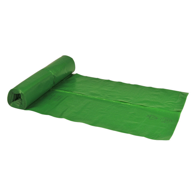 Eine teilweise ausgerollte grüne Abena Re-Seller GmbH Abfallsäcke 70 L, 575x1000 mm, 32 my LDPE Liner liegt auf einem weißen Hintergrund, mit dem Rest der Rolle - perfekt für eine effiziente Müllentsorgung.