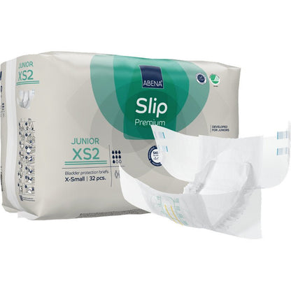 A pack of ABENA Slip Junior Premium Gr XS2 from Abena Re-Seller GmbH (32 pieces) is displayed with an incontinence product children's slip next to the green-white packaging.