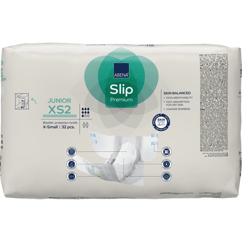 A white pack of ABENA Slip Junior Premium Gr XS2 from Abena Re-Seller GmbH (32 pieces) shows product details, size information, icons, and an illustration on the front, depicting this incontinence product for children in use.