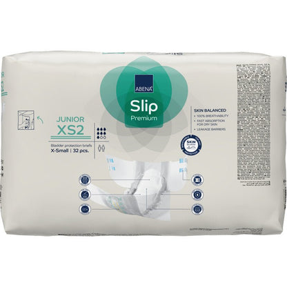 A white pack of ABENA Slip Junior Premium Gr XS2 from Abena Re-Seller GmbH (32 pieces) shows product details, size information, icons, and an illustration on the front, depicting this incontinence product for children in use.