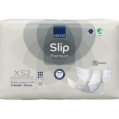 A 32-pack of ABENA Slip Premium from Abena Re-Seller GmbH in size XS2 X-Small in beige packaging with the certifications "High Performance Core" and "Skin Friendly" for reliable incontinence care.