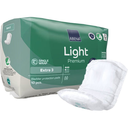 A pack of ABENA Light Extra 3, Premium from Abena Re-Seller GmbH contains 10 green-white bladder protection pads. A pad on the front shows the secure, discreet design for daily comfort.