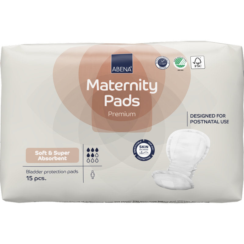 A pack of ABENA Maternity Pad, Premium from Abena Re-Seller GmbH contains 15 soft, absorbent inserts for the postpartum period, with certification symbols visible on the packaging.