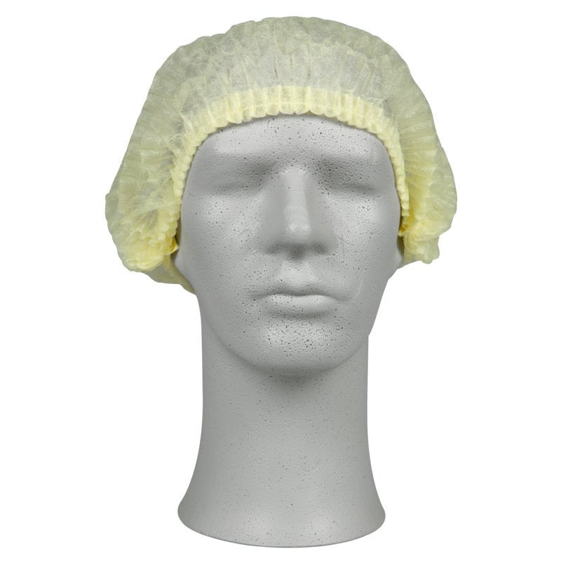 On the head of a mannequin is a light yellow clip cap, PP from Abena Re-Seller GmbH, which provides hygienic protection in the medical field or gastronomy, against a plain white background.