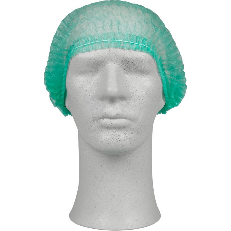 A white mannequin head displays a green clip cap made of PP from Abena Re-Seller GmbH, ideal for hygienic protection in the medical field or gastronomy. The mannequin is facing forward and stands against a plain background.