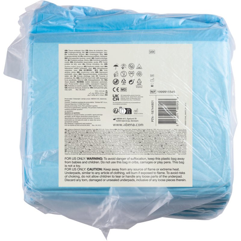 A transparent plastic package from Abena Re-Seller GmbH contains 25 blue, 6-layer ABENA Tissue disposable underpads, 60x60 cm. The back label shows product information, symbols, barcode, and multilingual warnings.